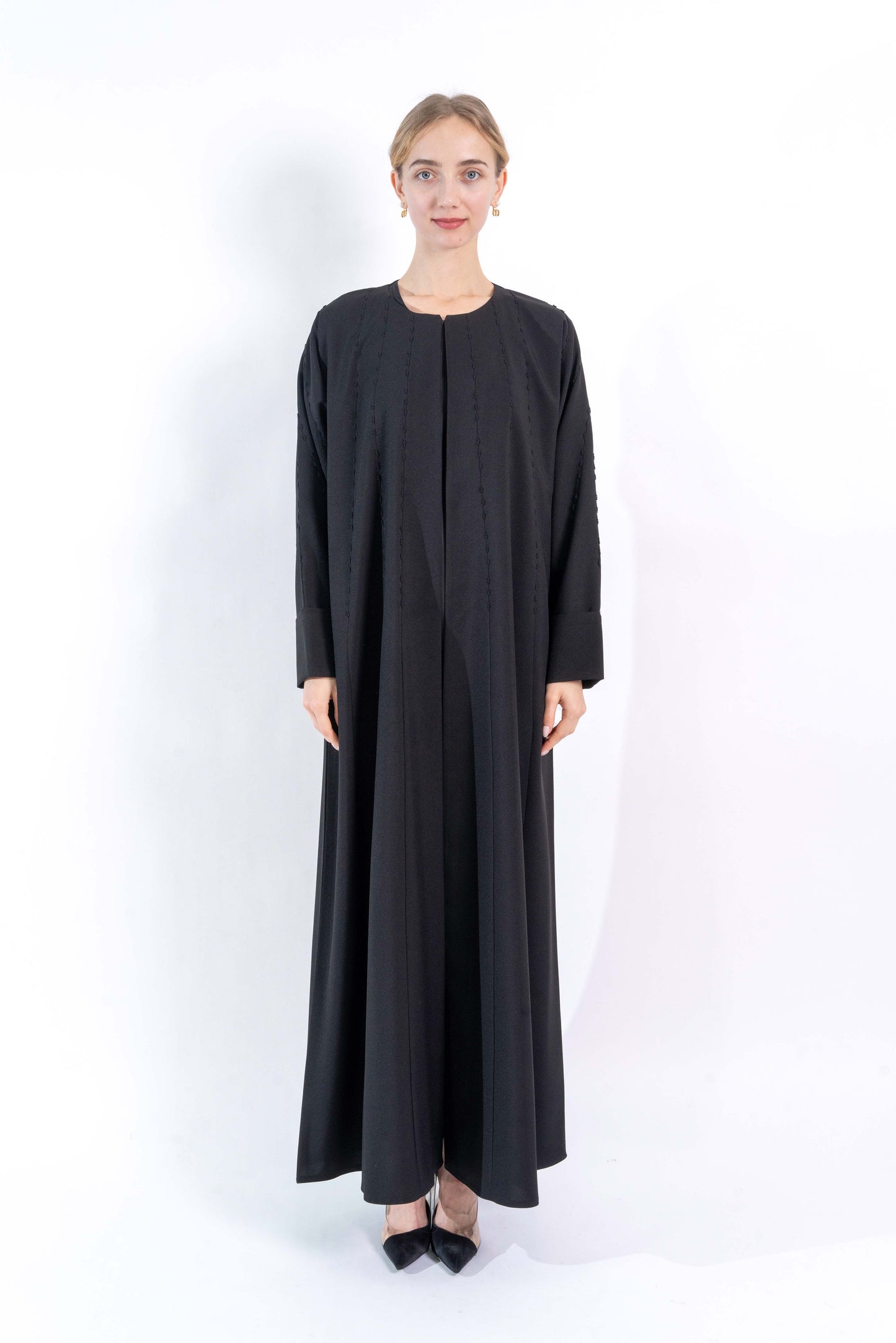 Black Abaya with embroidered pattern.