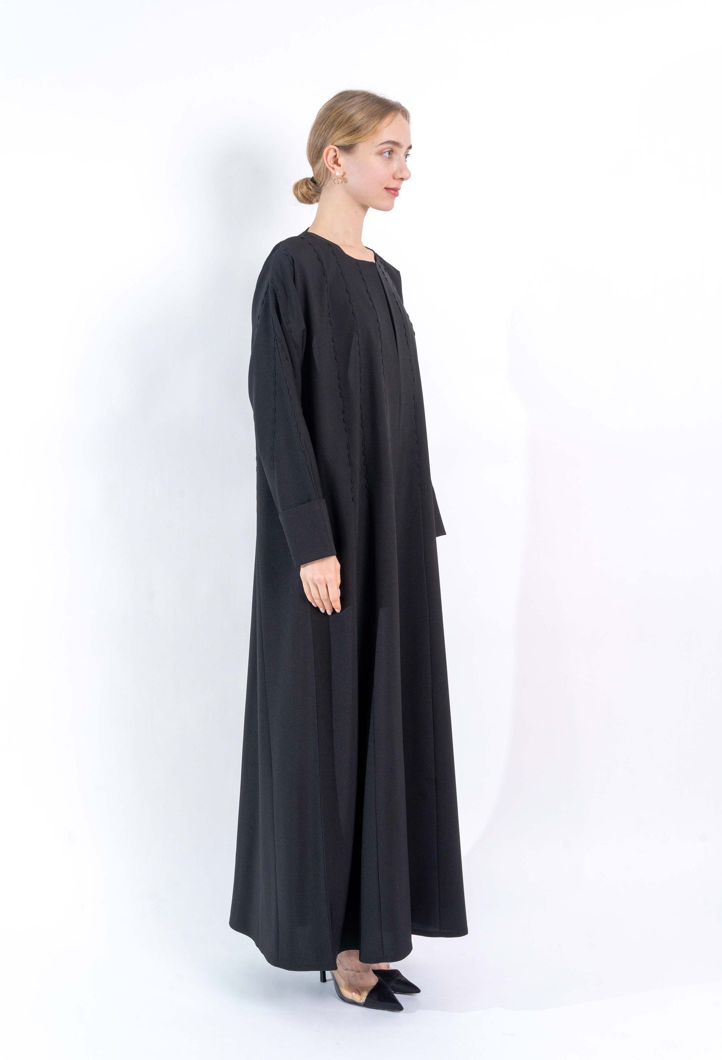 Black Abaya with embroidered pattern.