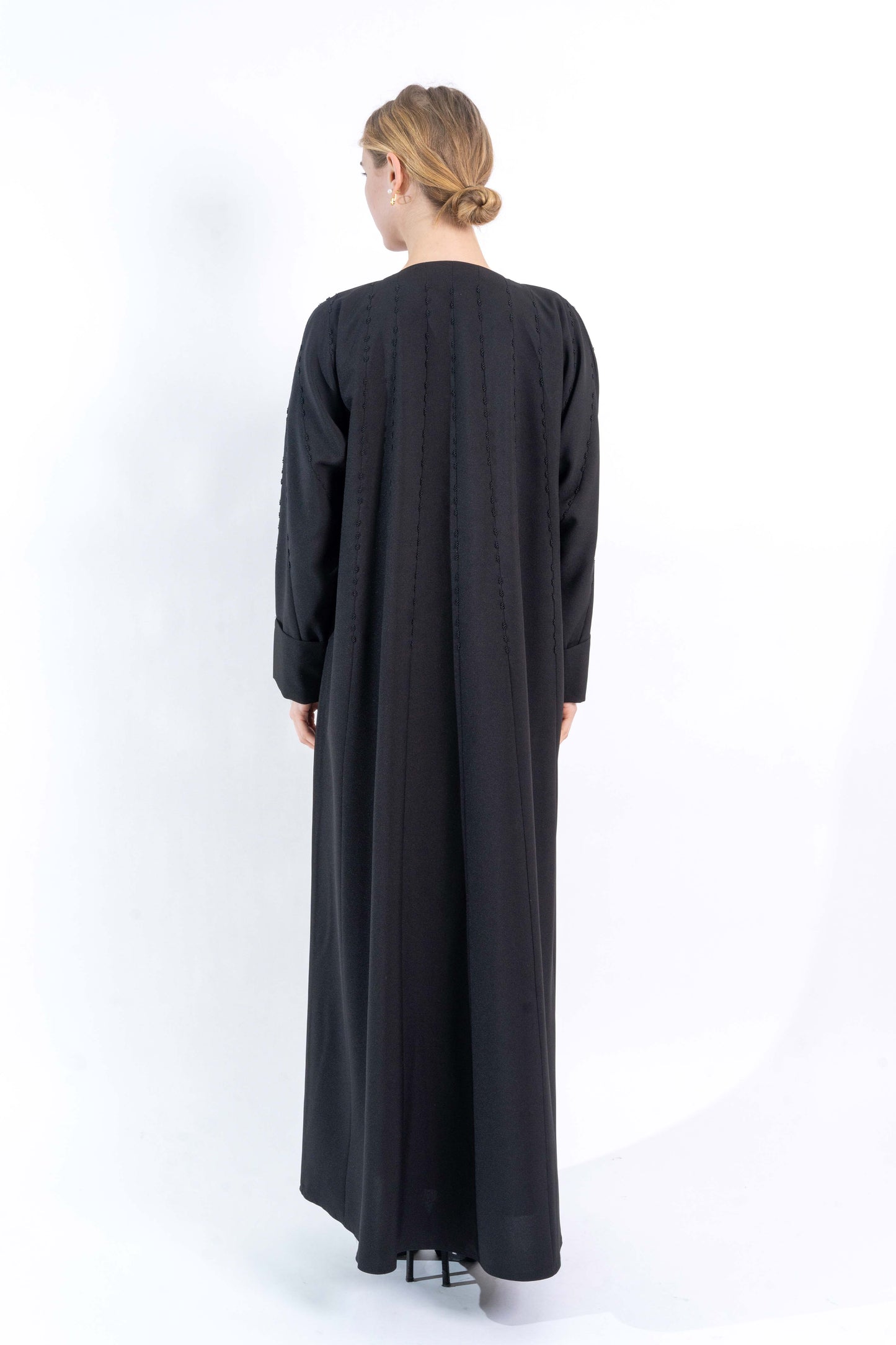 Black Abaya with embroidered pattern.