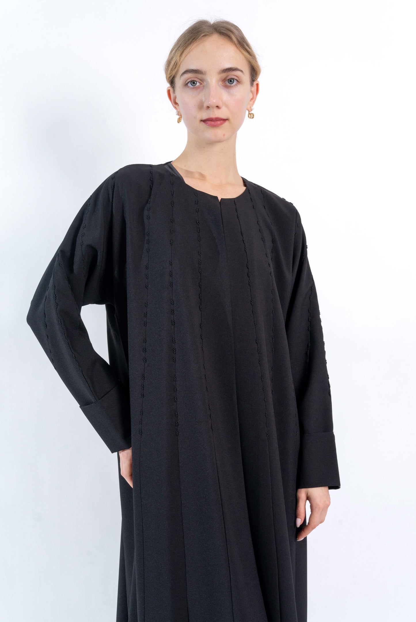 Black Abaya with embroidered pattern.